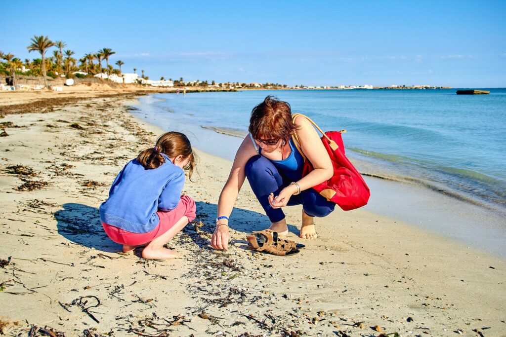 collecting shells on beach